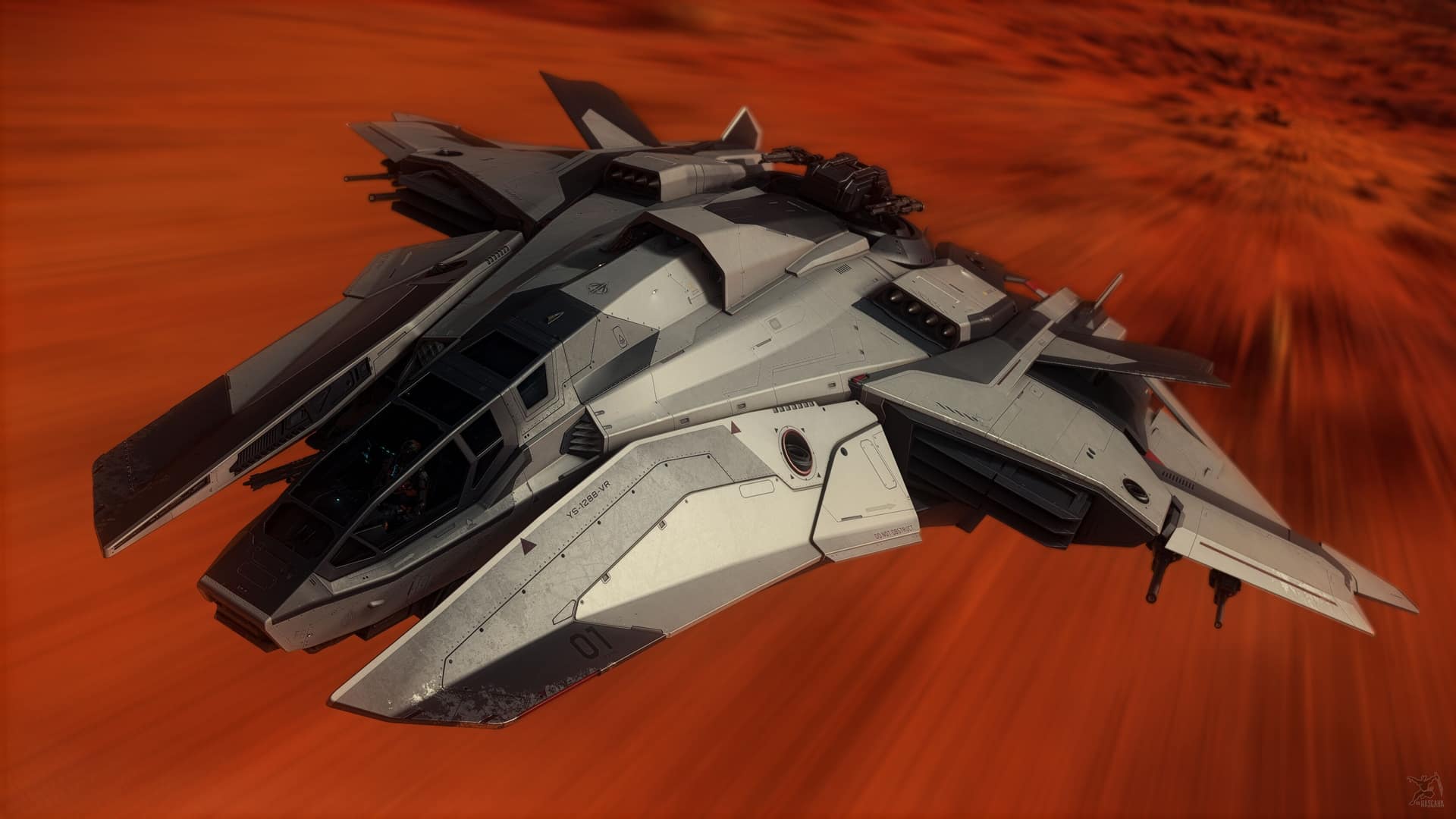 A grey heavy fighter with a manned top turret and open side hatch races low over an orange desert blurred by speed.